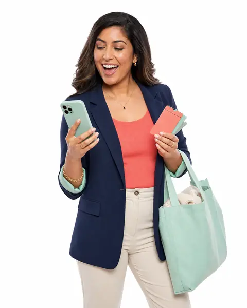 Woman smiling while checking a money-saving referral offer on her phone